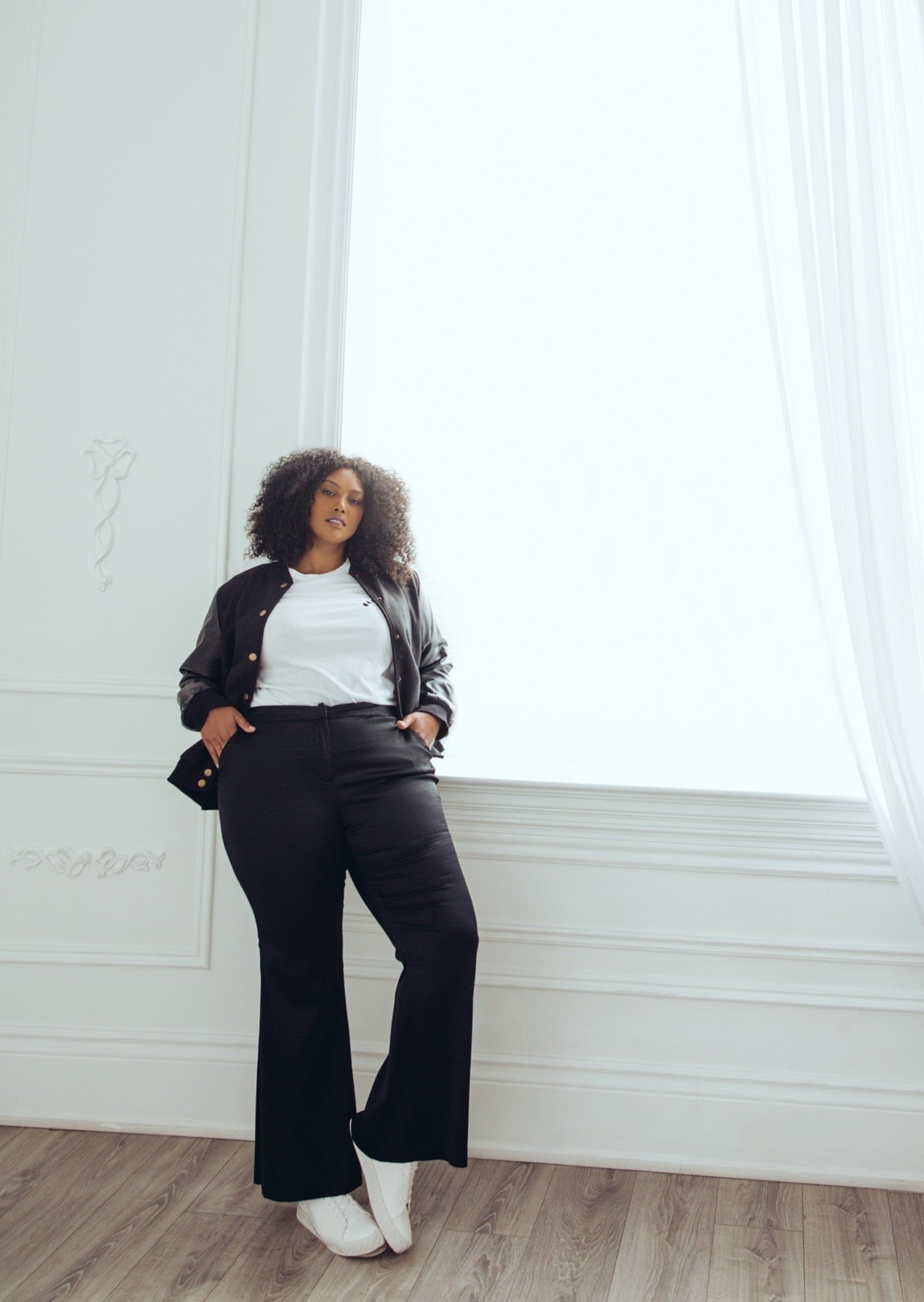 Model wearing plus size flare pants.