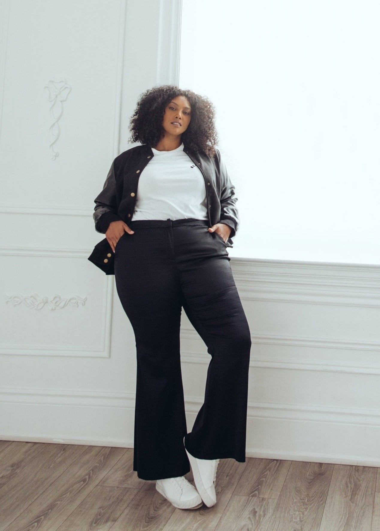Model wearing plus size flare pants.