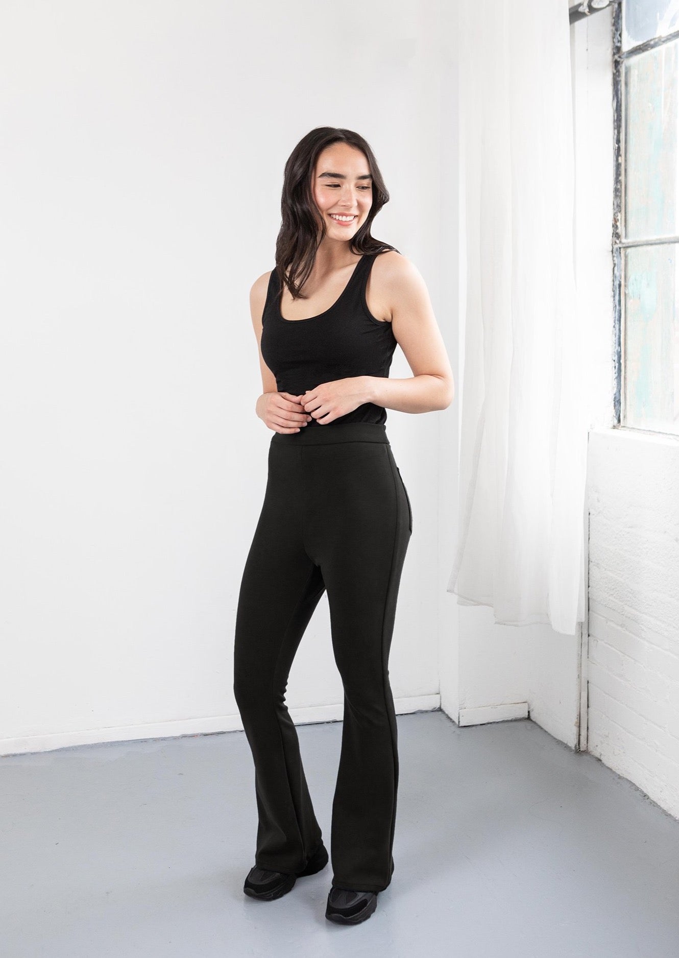 Model in black flare pants